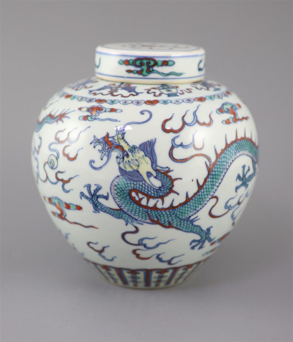 A Chinese doucai dragon jar and cover, Qianlong seal mark, late 19th/early 20th century, 20cm high, neck broken and glued